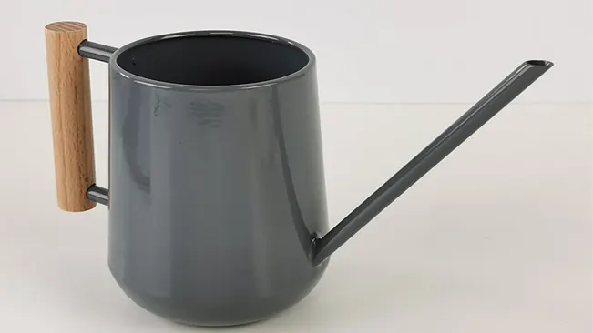Gray watering can with wooden handle