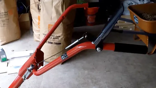 disassembled handle frame in a cluttered garage