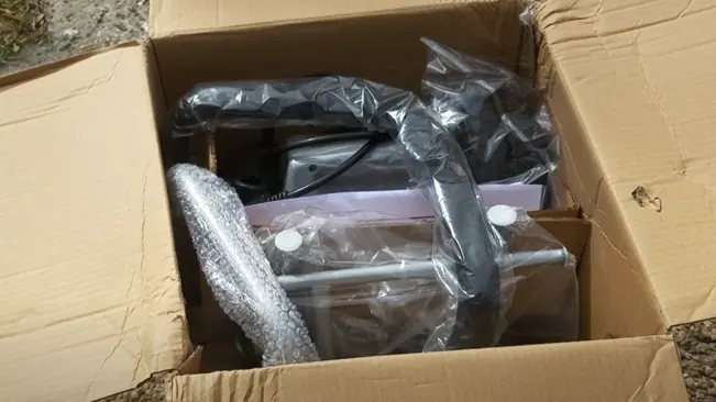 Cardboard box containing wrapped electronic items