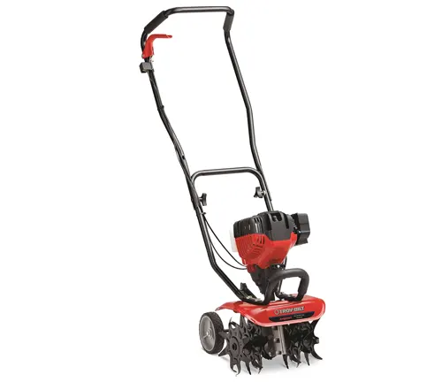 A red and black garden tiller with metal blades and a long handle.
