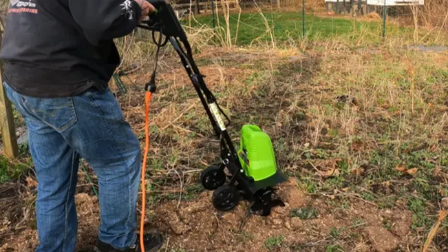 Person using GreenWorks Cultivator