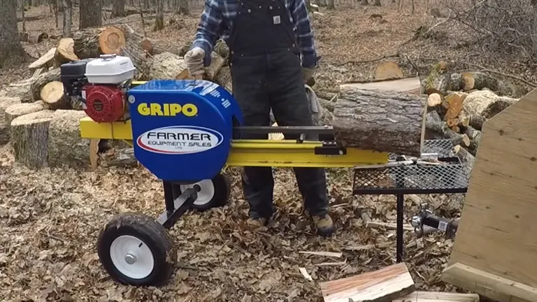 Person standing near 200 Gripo Log Splitter with logs everywhere