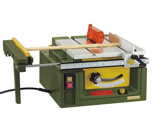 Green PROXXON table saw with a wooden plank, red switch, and control knobs