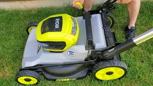 person mowing a lawn with a Ryobi lawnmower
