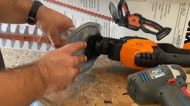 Person attaching a circular saw blade to a power tool