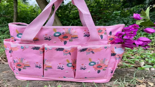 pink YANZI gardening tote bag with a floral design