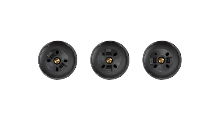 Three black spray paint gun tips with brass nozzles, displayed in a row against a white background.