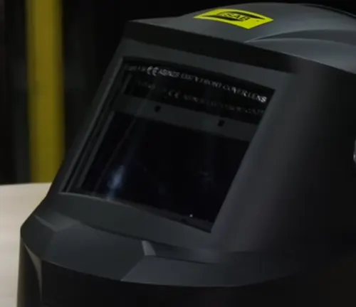 lose-up of the ESAB Savage A40 Air welding helmet lens and certification labels.
