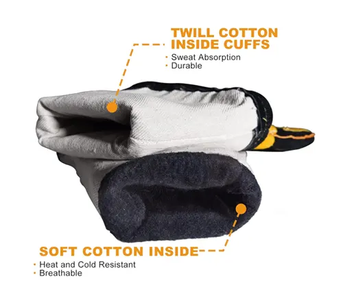 Inside view of a TOPDC welding glove showing twill cotton cuffs and soft cotton insulation for heat resistance and breathability.