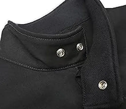 Close-up of the high collar area of a Lincoln Electric XVI Series Industrial Welding Jacket with silver snap buttons.