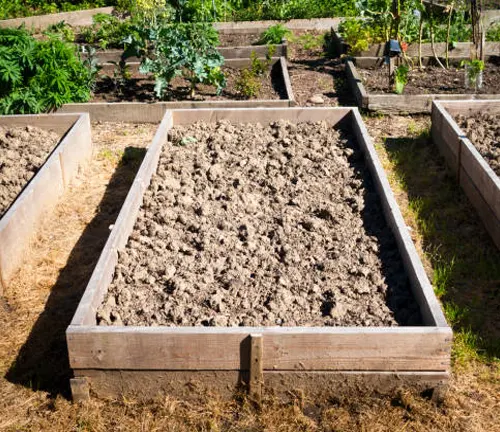 Raised garden bed with freshly tilled soil