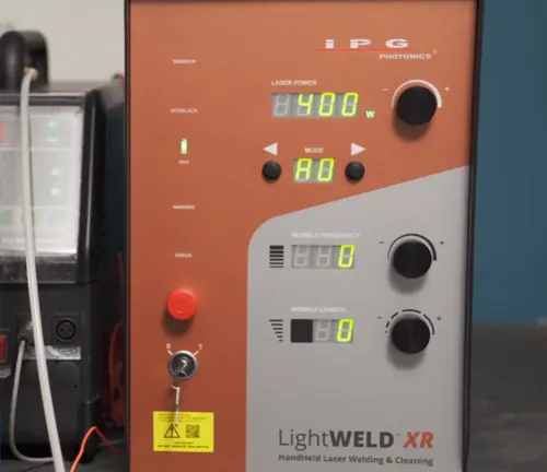 Close-up of the IPG LightWELD XR Handheld Laser control panel with digital displays for laser power and mode settings.