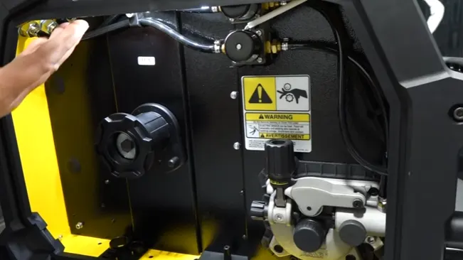 Close-up of the internal components of an Esab Rebel EMP 205IC AC/DC Multi-Process Welder with warning labels visible.