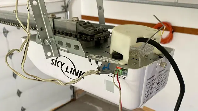 a white Skylink Atoms Garage Door Opener with wires