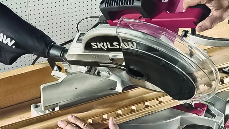 Person using a SKILSAW miter saw to cut wood