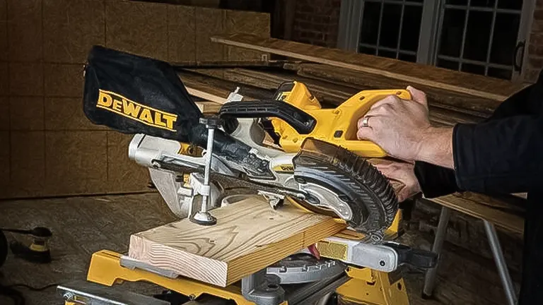 Person using a DEWALT miter saw to cut wood