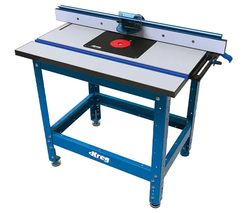A Kreg router table with a blue base and a large, flat work surface, equipped with a fence and an insert plate