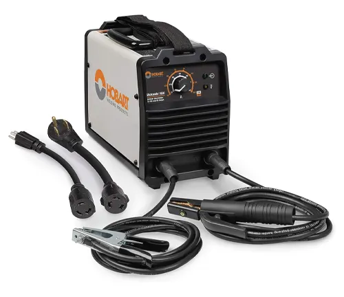 A Hobart Stickmate 160i stick welder with dual voltage plugs and welding cables