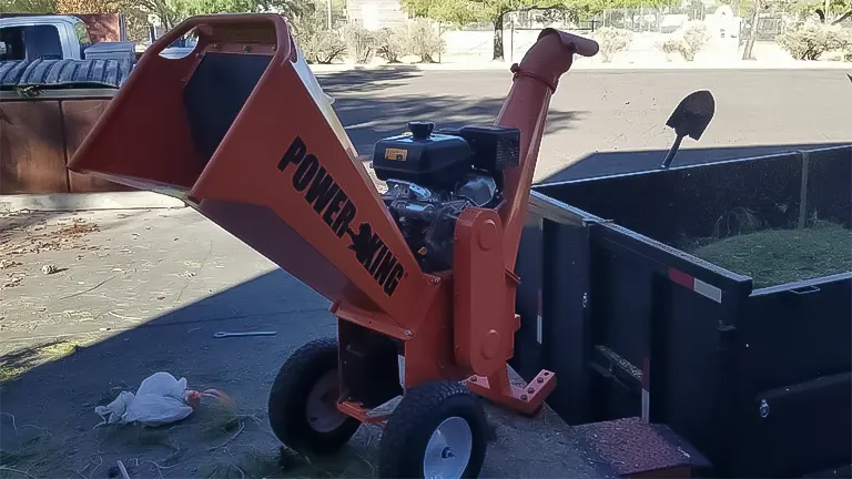 Power King wood chipper in operation outdoors