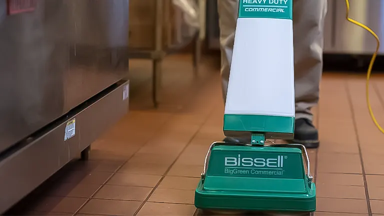 Bissell Big Green Commercial floor cleaner in use in a commercial kitchen setting