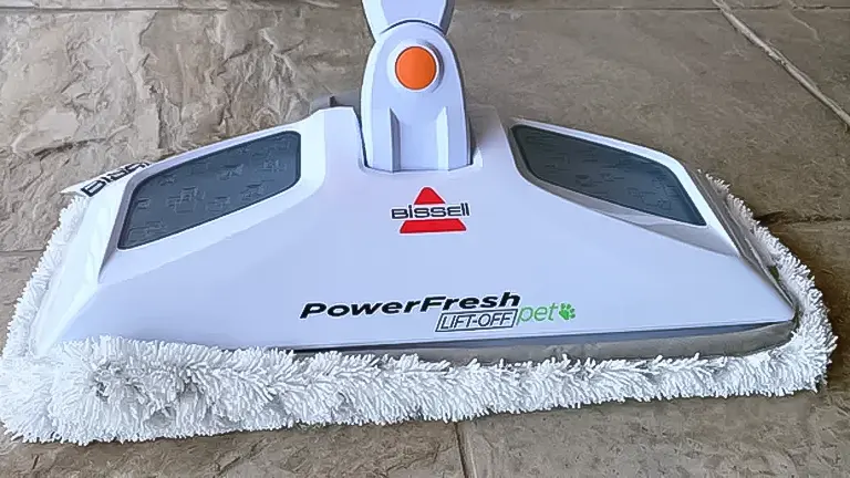 Close-up of a Bissell PowerFresh steam mop's cleaning head on a tiled floor
