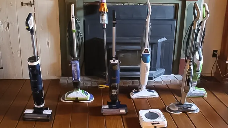A selection of six different floor cleaner machines displayed on a wooden floor