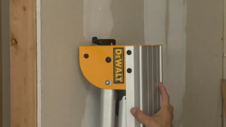 Person mounting the DeWalt DWX725 to the wall