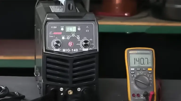 GZ GUOZHI 140Amp Welding Machine displayed next to a multimeter showing 140.1 volts
