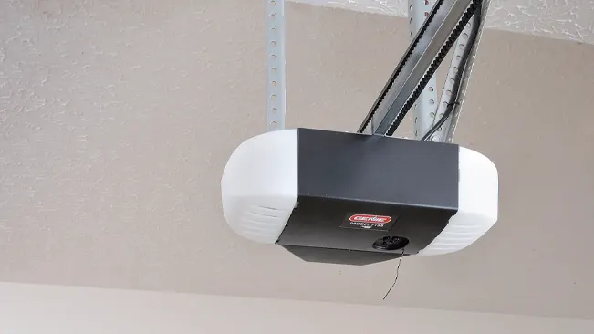 Genie 2055-LED Essentials Garage Door Opener with dual chain drive, mounted on ceiling with metal brackets.