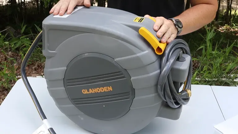 Person holding Glahoden Hose Reel