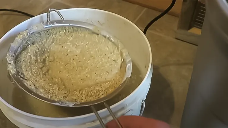 Heating a pot of rice for chick feed preparation