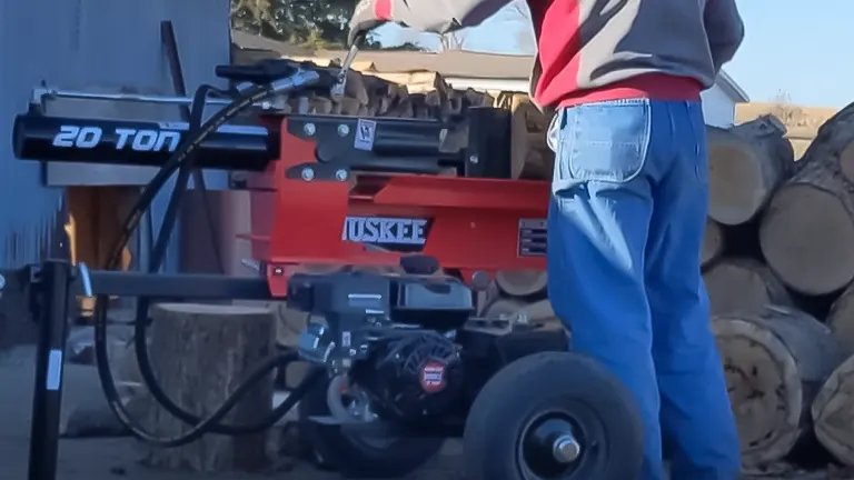 Person operating a Huskee 209cc Engine 20T Log Splitter outdoors