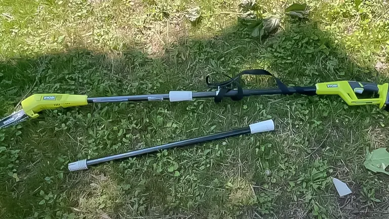 RYOBI ONE+ 18V 8-inch cordless pole saw disassembled on grass