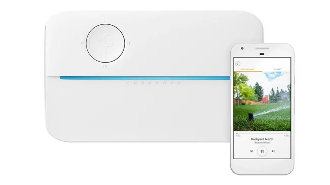 Rachio 3 smart sprinkler controller next to a smartphone with its companion app open, displayed