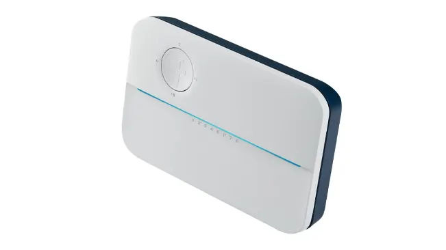 Rachio 3 smart sprinkler controller with a white facade, blue accent line, and control dial, isolated on a white background