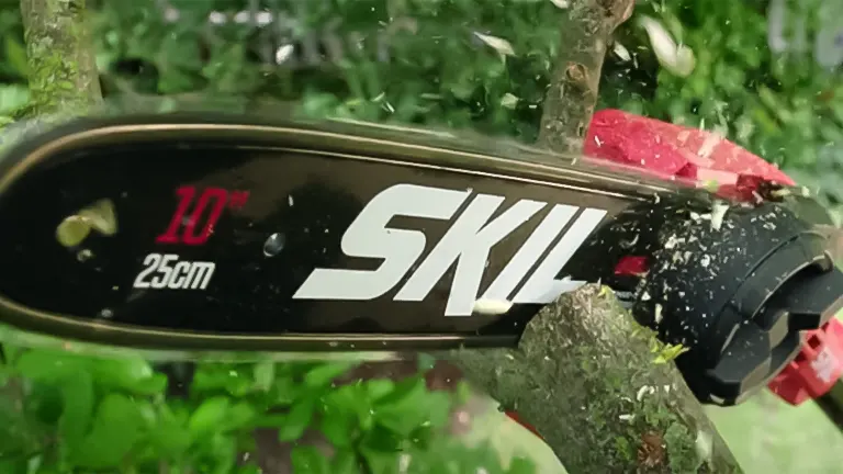 Close-up of a SKIL PS4561C-10 pole saw cutting a branch, highlighting the 10-inch blade and SKIL logo