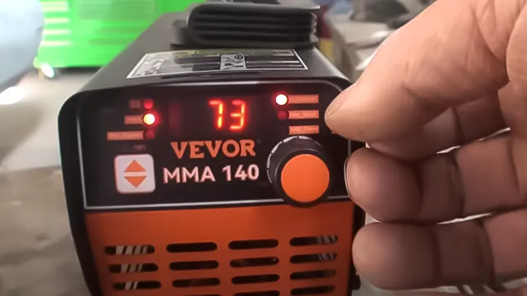 Compact VEVOR Mini 140A Stick Welder with visible controls