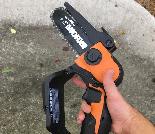 Handheld Worx cordless pruning saw with safety switch