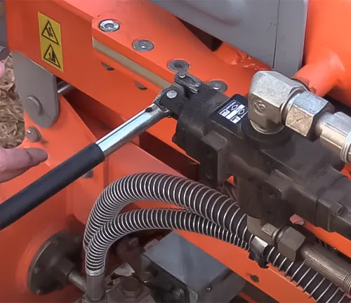 Close-up of the hydraulic system and control lever on a YARDMAX XR1450 40-Ton Gas Log Splitter