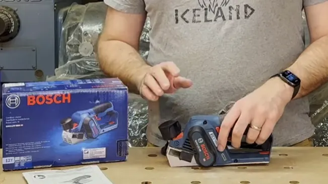 Person demonstrating a Bosch cordless planer