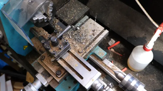 Metalworking lathe covered in shavings