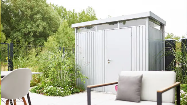 Contemporary garden shed with a minimalist design in a lush backyard