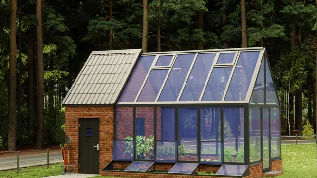 Hybrid greenhouse and brick garden shed against a forest backdrop.