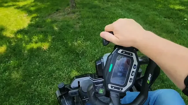 Person using remote control lawn mower