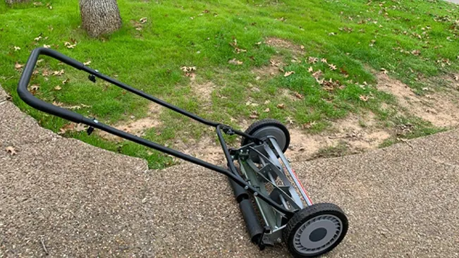 Lawn mower on sidewalk