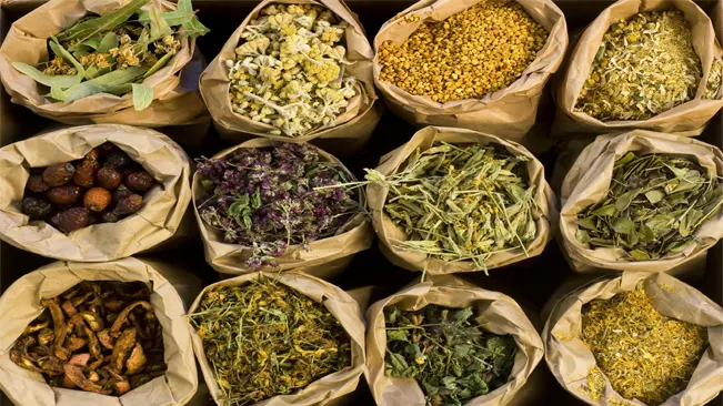 assorted dried and stored herbs on a sack