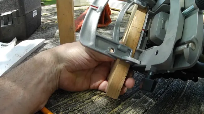 Person cutting wood with porter cable.