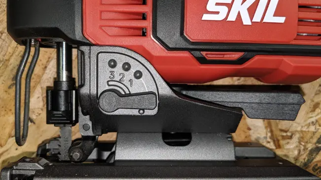 Close-up of a SKIL power tool with adjustable settings, mounted on a surface