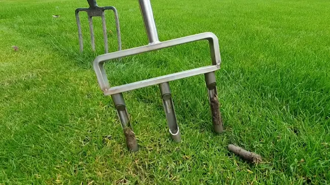 Gardening tools on green grass.