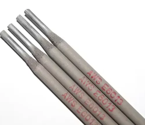 A close-up of grey welding rods with red text indicating 'AWS E6013' specifications.






